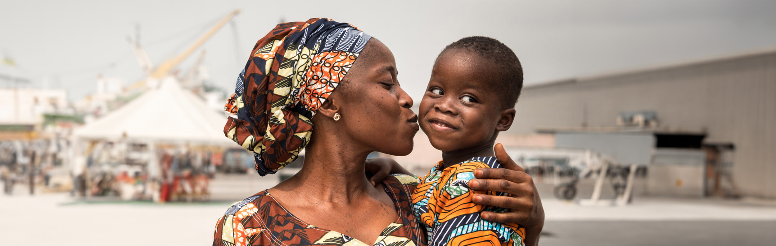 Symbolic image of a mother embracing her son