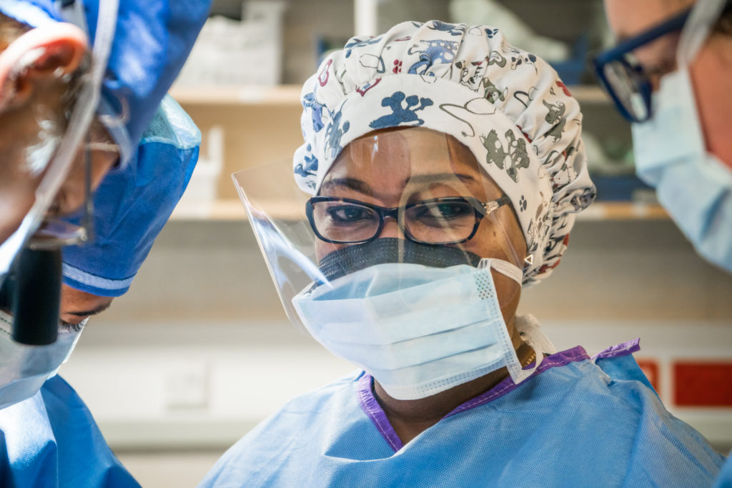 Dr. Fifonsi Odry Agbessi, Benin’s first and only plastic surgeon, works with Dr. Tertius Venter (ZAF) learning from him in the OR.