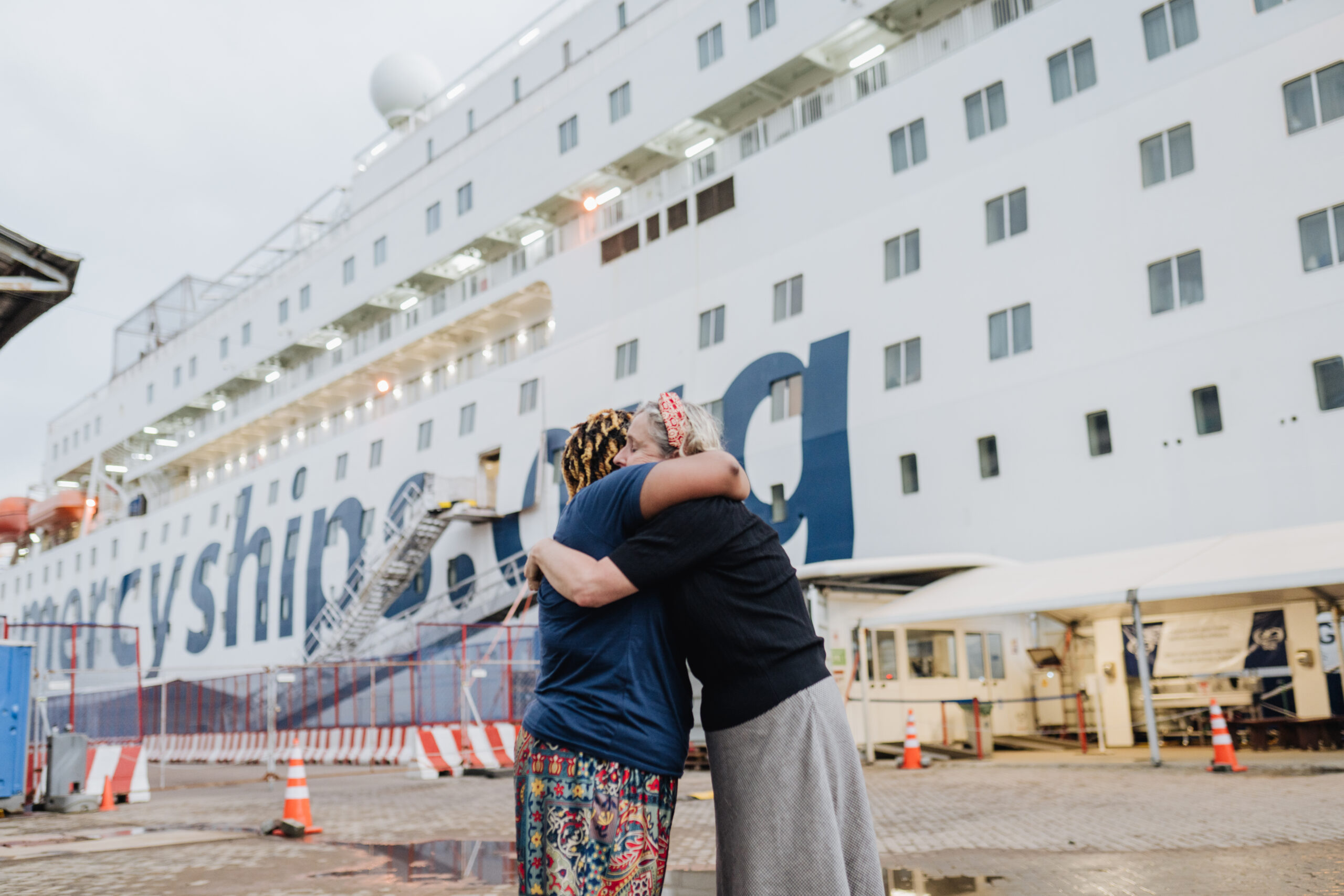 Aly Hall and Catherine Conteh hugging after not seeing each other for 30 years.