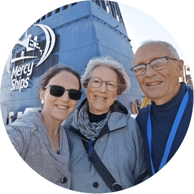 Greg (right) and Wendy Gilbert (middle) of Ontario, parents of Danita (left), a volunteer nurse by training who became a Hospital Quality Manager.